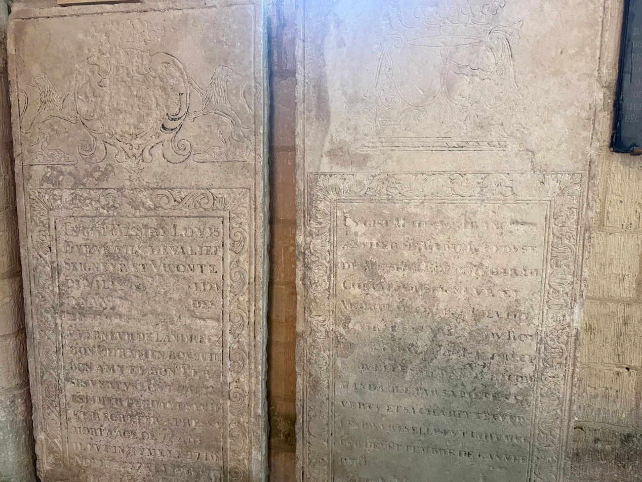 The slabs are displayed in the left side aisle of the Church of Saint-Martin.